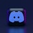 A 3D-style block with a blue logo in the center, set against a dark background. The logo resembles a game controller with two rounded edges and two circles on the front. The block has a subtle gradient, transitioning from dark to purple on its sides.